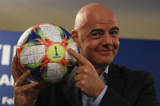 FIFA President Gianni Infantino holds the official ball of the upcoming Women's Soccer World Championship as he poses for photographers during a press conference at the end of an executive committee meeting in Rome, Wednesday, Feb. 27, 2019. [Photo: AP]