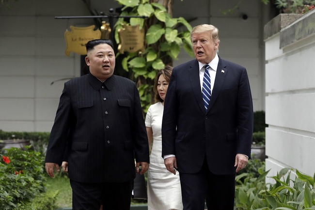 President Donald Trump and North Korean leader Kim Jong Un take a walk after their first meeting at the Sofitel Legend Metropole Hanoi hotel, Thursday, Feb. 28, 2019, in Hanoi. [File Photo: IC]