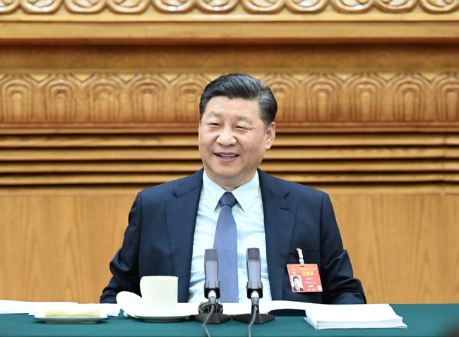 President Xi Jinping attends a panel discussion with his fellow deputies from Henan Province at the second session of the 13th National People's Congress in Beijing, March 8, 2019. [Photo: Xinhua]