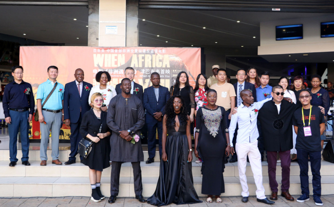 The cast and crew of the film "When African Meets You" as well as guests take a group photo at its premiere in Harare on Sunday, March 10, 2019. [Photo: China Plus/Gao Junya]