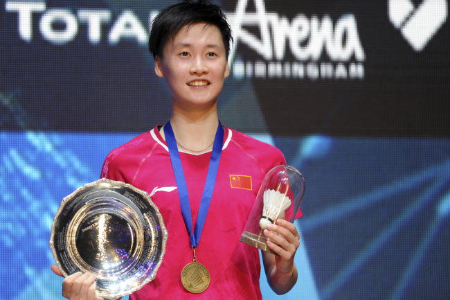 Chiense shuttler Chen Yufei of China poses on the podium after defeating Tai Tzu Ying of Chinese Tapei in the Women's Singles final at the All England Open Badminton tournament in Birmingham, England, Sunday March 10, 2019. [Photo: AP]