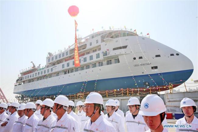 Photo taken on March 12, 2019 shows the launching ceremony of the first China-made cruise ship for polar expeditions, held in Haimen, east China's Jiangsu Province. The first China-made cruise ship for polar expeditions tested the water on Tuesday in Haimen, east China's Jiangsu Province. Hu Xianfu, general manager of the shipbuilder China Merchants Group, said the 104.4-meters long vessel is 18.4 meters at the beam. It can operate at a speed of 15.5 knots. With a gross tonnage of 7,400 tonnes, it can accommodate 255 people on board. [Photo: Xinhua/Xu Congjun]
