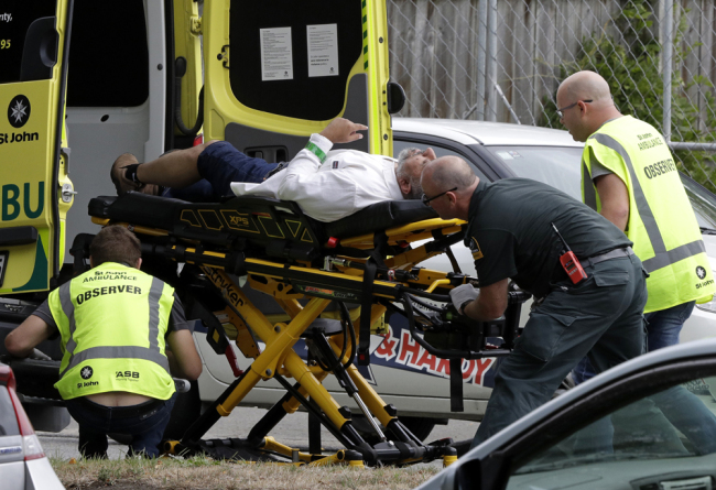 Ambulance staff take a man from outside a mosque in central Christchurch, New Zealand, Friday, March 15, 2019. [Photo: AP/Mark Baker]