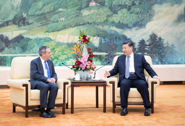 Chinese President Xi Jinping (R) meets with president of Harvard University Lawrence Bacow at the Great Hall of the People in Beijing, capital of China, March 20, 2019. [Photo: Xinhua]