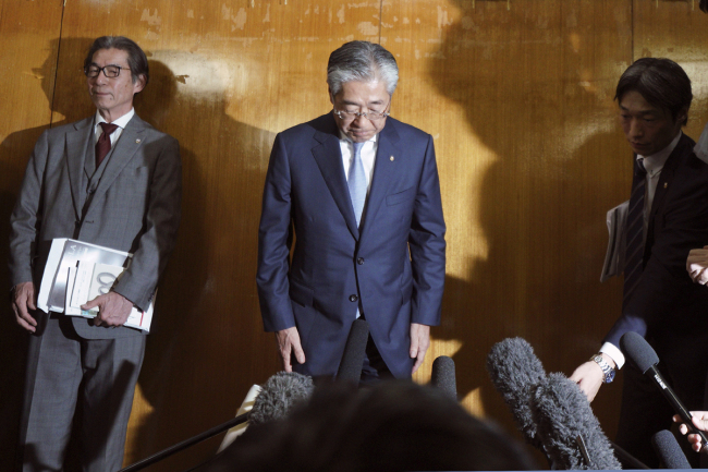 International Olympics Committee member and head of the Japanese Olympic Committee Tsunekazu Takeda bows as he speaks after a JOC executive board meeting in Tokyo Tuesday, March 19, 2019. Takeda is resigning amid a bribery scandal that investigators suspect helped Tokyo land next year's Olympics. Takeda announced Tuesday he will stand down when his term ends in June, but he denied corruption allegations against him. [Photo: AP]