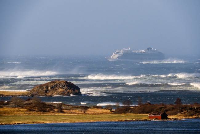 The cruise ship Viking Sky as it drifts after sending a Mayday signal because of engine failure in windy conditions near Hustadvika, off the west coast of Norway, Saturday March 23, 2019. The Viking Sky is forced to evacuate its estimated 1,300 passengers. [Photo: AP/Odd Roar Lange]