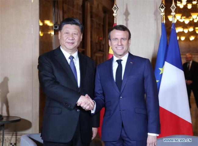Chinese President Xi Jinping (L) meets with French President Emmanuel Macron in the southern French city of Nice on March 24, 2019. [Photo: Xinhua/Ju Peng]