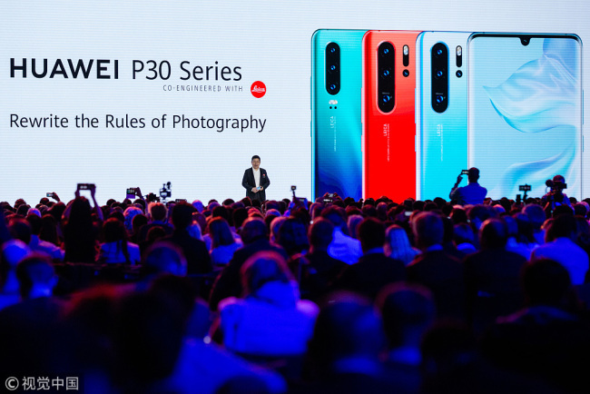 Richard Yu, chief executive officer of Huawei Technologies, presents the P30 series smartphone during a launch event in Paris, France on March 26, 2019. [Photo: VCG]
