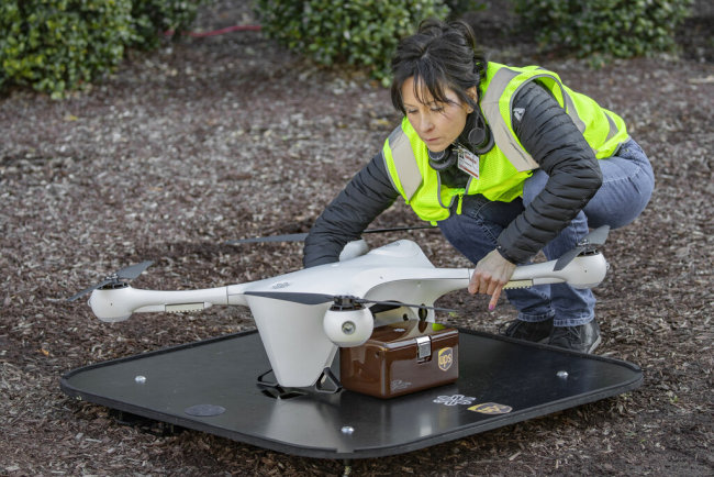 In this March 2019 photo provided by UPS, a drone operator handles a drone used for carrying medical specimens at a landing area at WakeMed hospital in Raleigh, N.C. UPS, Matternet and WakeMed announced a program on Tuesday, March 26, 2019, to use drones for commercial flights of blood samples and other medical specimens at the North Carolina hospital campus. [Photo: AP]