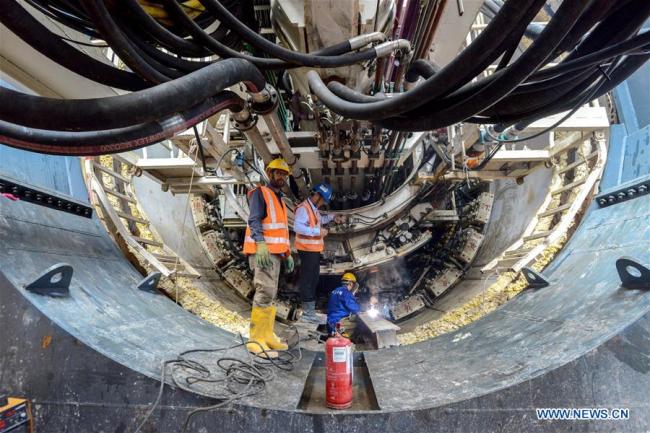 People work at the construction site of the Tunnel Boring Machine (TBM) in Kuala Lumpur, Malaysia, March 28, 2019. [Photo: Xinhua/Chong Voon Chung]
