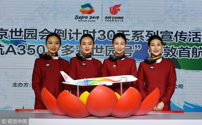 A ceremony for the first international flight of an Air China plane with colorful logo of the 2019 International Horticultural Expo is held in Beijing on March 31, 2019. [Photo: VCG]
