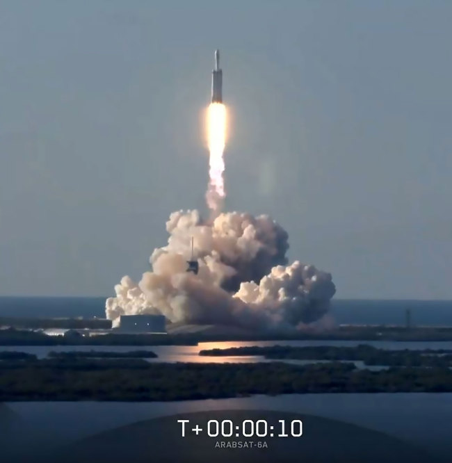 This still image from video courtesy of SpaceX shows the SpaceX Falcon Heavy Rocket lifting off from Kennedy Space Center in Florida, April 11, 2019. [Photo: AFP/ SPACEX]