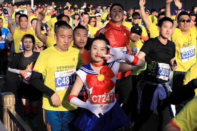 Runners taking part in the 2019 Beijing Half Marathon on Sunday, April 14, 2019. [Photo: IC]
