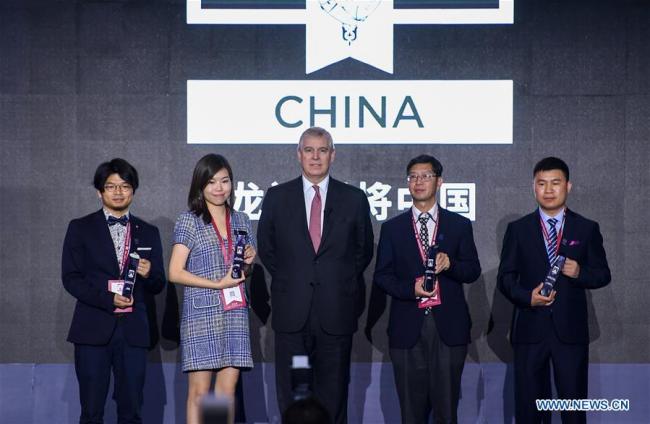 British Prince Andrew (C), the Duke of York, poses for a group photo with the winners during the final of Pitch@Palace China in Shenzhen, south China's Guangdong Province, April 14, 2019. [Photo: Xinhua/Mao Siqian]