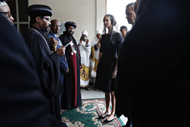 White House senior adviser Ivanka Trump, center, is greeted as she arrives for a ceremony at Holy Trinity Cathedral honoring the victims of the Ethiopian Airlines crash, Monday, April 15, 2019, in Addis Ababa, Ethiopia. [Photo: AP/Jacquelyn Martin]