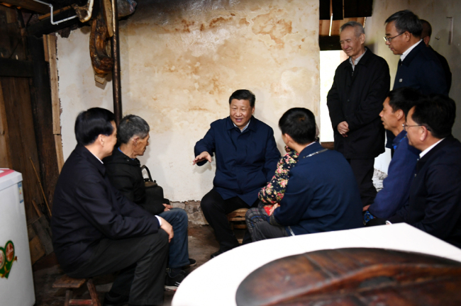 Chinese President Xi Jinping visits a villager's home to learn about the progress of poverty alleviation and in solving prominent problems including meeting the basic need of food and clothing and guaranteeing compulsory education, basic medical care and safe housing, in Huaxi Village of Shizhu Tujia Autonomous County, southwest China's Chongqing, April 15, 2019. [Photo: Xinhua]