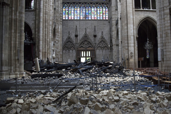 A general view shows debris inside the Notre-Dame-de Paris Cathedral in Paris on April 16, 2019, a day after a fire that devastated the building in the center of the French capital. [Photo: AFP/Amaury Blin]