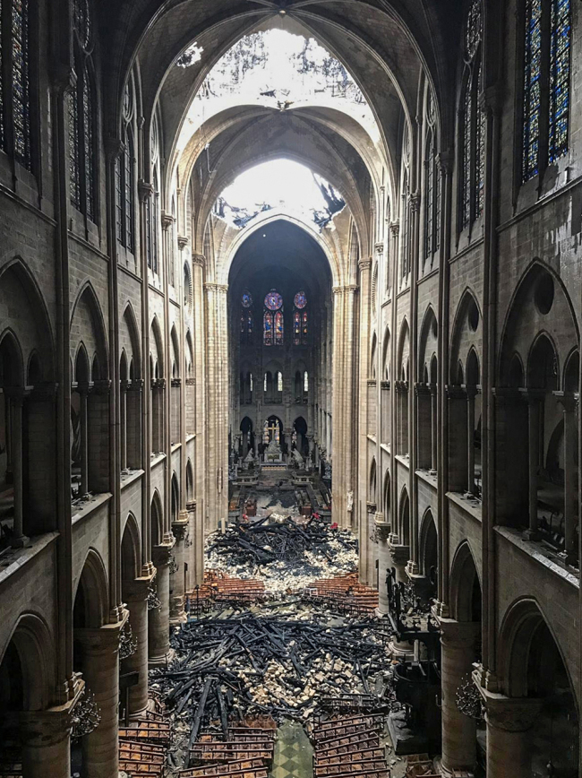 A picture taken on April 16, 2019 shows an interior view of the Notre-Dame Cathedral in Paris in the aftermath of a fire that devastated the cathedral. [Photo: AFP]