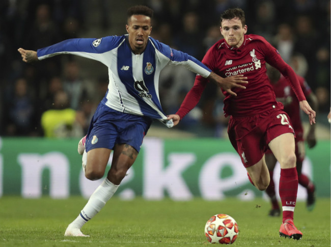 1. Porto defender Eder Militao, left, duels for the ball with Liverpool's Andrew Robertson during the Champions League quarterfinals 2nd leg soccer match at Dragao stadium in Porto, Portugal on Wednesday, April 17, 2019. [Photo: AP]
