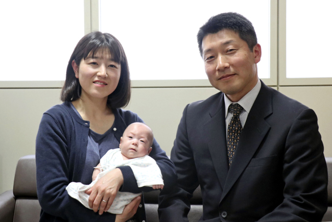 Seven-month-old Ryusuke Sekiya is pictured with his parents the day before his scheduled discharge from a hospital in Azumino in Japan's Nagano Prefecture on Friday, April 19, 2019. [Photo: Kyodo News via AP]