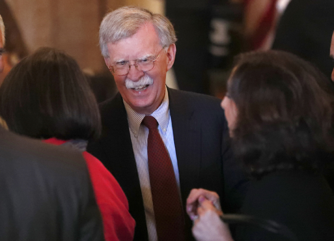 National Security Adviser John Bolton, center, chats attendees at the Bay of Pigs Veterans Association luncheon Wednesday, April 17, 2019, in Coral Gables, Florida, the United States. [FIle Photo: AP] 