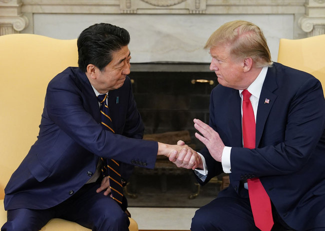 US President Donald Trump takes part in a bilateral meeting with Japan's Prime Minister Shinzo Abe in the Oval Office of the White House in Washington, DC on April 26, 2019. [Photo: AFP/Mandel Ngan]