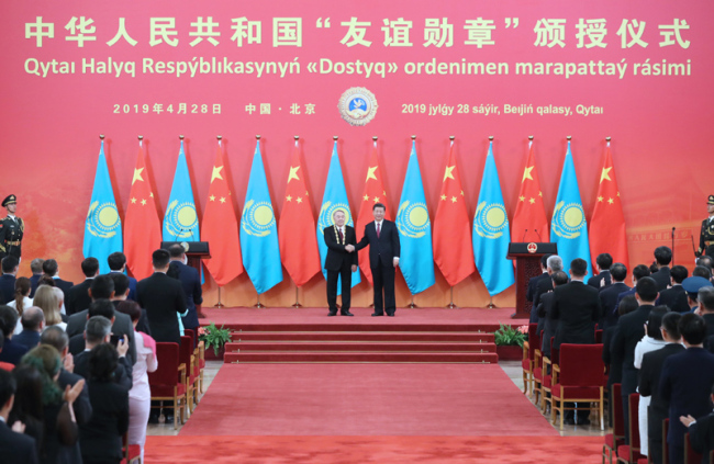 Chinese President Xi Jinping holds a ceremony to award the first president of Kazakhstan Nursultan Nazarbayev the Friendship Medal of the People's Republic of China at the Great Hall of the People in Beijing on April 28, 2019. [Photo: Xinhua]