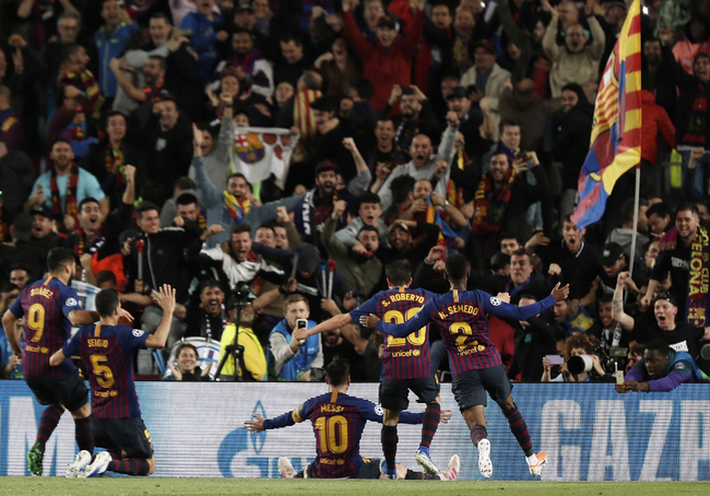 Barcelona's Lionel Messi, center, celebrates after scoring his side's third goal during the Champions League semifinal, first leg, soccer match between FC Barcelona and Liverpool at the Camp Nou stadium in Barcelona Spain, Wednesday, May 1, 2019. [Photo: AP/Joan Monfort]