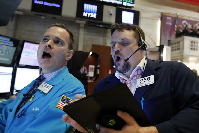 Specialist John Alatzas, left, and trader Michael Milano work on the floor of the New York Stock Exchange, Wednesday, May 1, 2019. [Photo: AP]