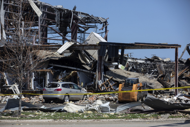 Debris can be seen as emergency personnel and others search and clear the scene of an explosion and fire at AB Specialty Silicones chemical plant Saturday, May 4, 2019, in Waukegan, Illinois. [Photo: AP]
