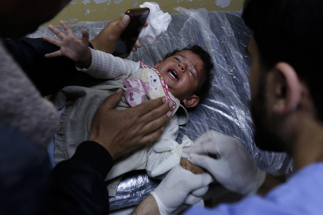 An injured Palestinian baby cries at a hospital in Beit Lahia, northern Gaza strip on May 5, 2019. [Photo: AFP]