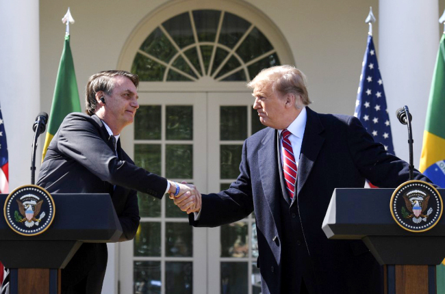 U.S. President Donald Trump shakes hands with Brazil's President Jair Bolsonaro during a joint press conference in the Rose Garden at the White House on March 19, 2019 in Washington, DC. [Photo: AFP/Jim Watson]