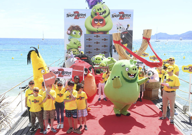 Children dressed in costume pose for pics during an eventl for the film "The Angry Birds Movie 2" at the 72nd Cannes International Film Festival in southern France on Monday, May 13, 2019. [Photo: IC]