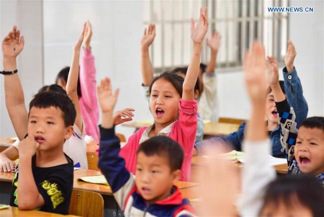 Children attend a class at Nongyong Primary School in Bansheng Township of Dahua Yao Autonomous County, south China's Guangxi Zhuang Autonomous Region, May 10, 2019. [Photo: Xinhua/Huang Xiaobang]