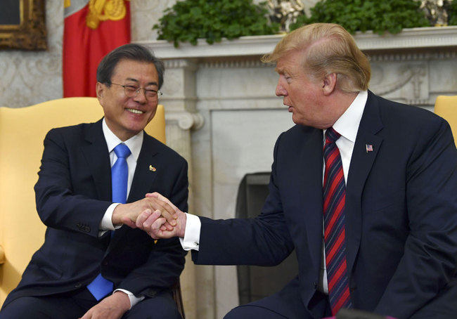 In this file photo taken on April 11, 2019, U.S. President Donald Trump shakes hands with South Korean President Moon Jae-in in the Oval Office at the White House in Washington, DC. [File photo: AFP/Nicholas Kamm]