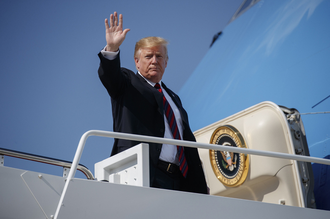 U.S. President Donald Trump waves as he boards Air Force One for a trip to New York to attend a fundraiser, Thursday, May 16, 2019, at Andrews Air Force Base, Md. [Photo: AP/Evan Vucci]