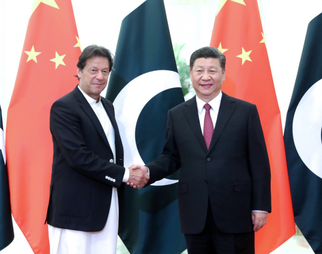 Chinese President Xi Jinping (R) meets with Pakistani Prime Minister Imran Khan at the Great Hall of the People in Beijing on April 28, 2019. [Photo: Xinhua]