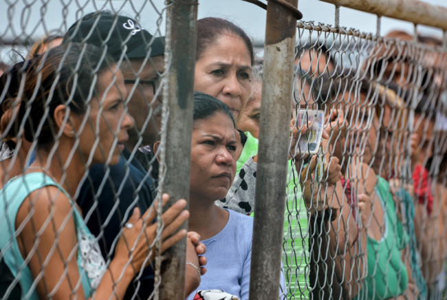 Relatives of inmates gather on May 18, 2018 outside the Fenix Community Penitentiary where a riot left at least 11 people dead on the eve, in the town of Irribarren, Lara State, in northern Venezuela. [File Photo: AFP]
