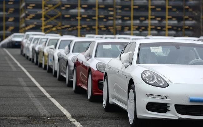 Porsche cars destined for export overseas stand parked and waiting to be loaded onto ships on January 22, 2014 in Bremerhaven, Germany. [File photo: Getty Images/David Hecker]