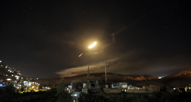 Syrian air defense missiles are seen in the sky over the capital Damascus, Syria, responding to a new wave of Israeli missile strikes, May 10, 2018. [File photo: EPA/Youssef Badawi]