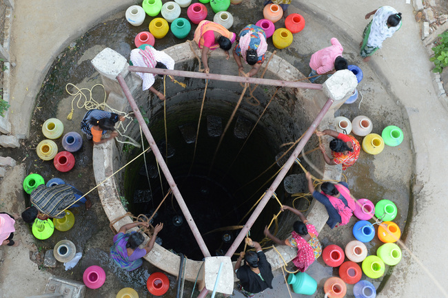 In this file photo taken on May 29, 2019, Indian residents fetch drinking water from a well in the outskirts of Chennai. [Photo: AFP]