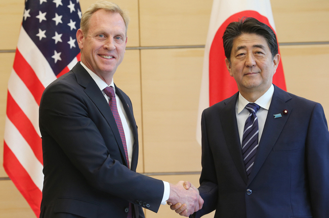 Japanese Prime Minister Shinzo Abe (R) shakes hands with US Acting Secretary of Defense Patrick Shanahan prior to their meeting in Tokyo on June 4, 2019. [Photo: AFP Pool/AFP/Koji Sasahara]