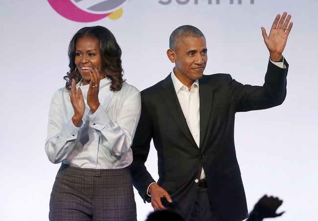 In this Oct. 31, 2017 file photo, former President Barack Obama, right, and former first lady Michelle Obama appear at the Obama Foundation Summit in Chicago. [Photo: AP]