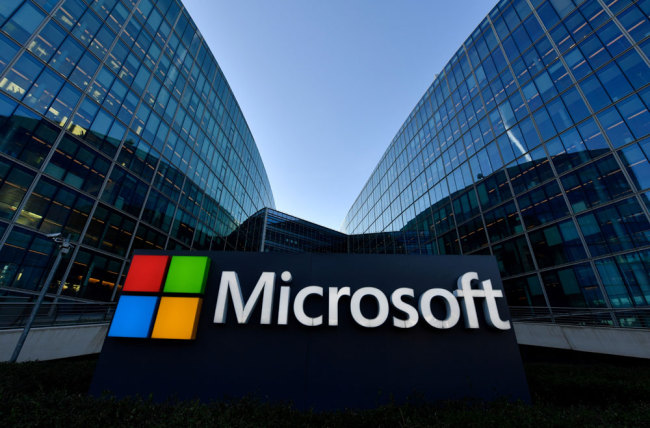The logo of French headquarters of American multinational technology company Microsoft, is pictured outside on March 6, 2018 in Issy-Les-Moulineaux, a Paris' suburb. [File photo: AFP/Gerard Julien]