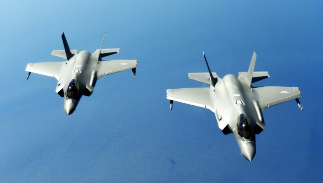 Two U.S. Air Force F-35 Lightning II stealth fighter aircraft fly in formation as they wait to refuel from a KC-135 Stratotanker during NATO exercise Astral Knight 19 June 3, 2019 over the Adriatic Sea. [File photo: IC]