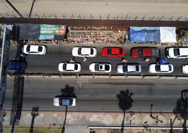 File Photo: Motorists wait in line to cross the border into Calexico, California from Mexicali, Mexico on Monday, April 1, 2019 in Mexicali, Mexico on April 01, 2019. [Photo: AFP/SANDY HUFFAKER]