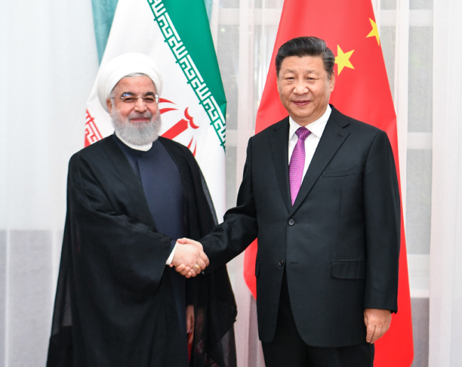 Chinese President Xi Jinping (R) meets with Iranian President Hassan Rouhani in Bishkek, Kyrgyzstan, June 14, 2019. [Photo: Xinhua]