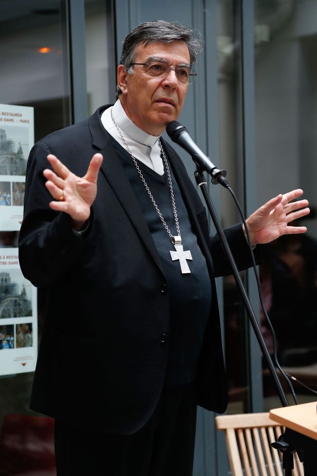 The Archbishop of Paris Michel Aupetit speaks to the press in the court yard of his diocese after leading the first mass two months to the day after a devastating fire engulfed the Notre-Dame de Paris cathedral on June 15, 2019, in Paris. [Photo: VCG]