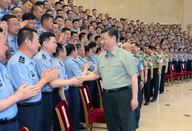 Chinese President Xi Jinping meets with delegates attending the 13th Party Congress of the Chinese People's Liberation Army (PLA) Air Force in Beijing on Tuesday, June 18, 2019. [Photo: Xinhua]