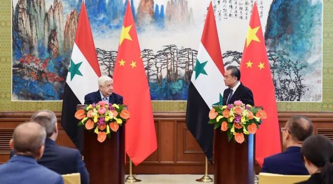 Chinese State Councilor and Foreign Minister Wang Yi and Syrian Deputy Prime Minister and Foreign Minister Walid Mualem meet the press after their meeting in Beijing on Tuesday, June 18, 2019. [Photo: fmprc.gov.cn]